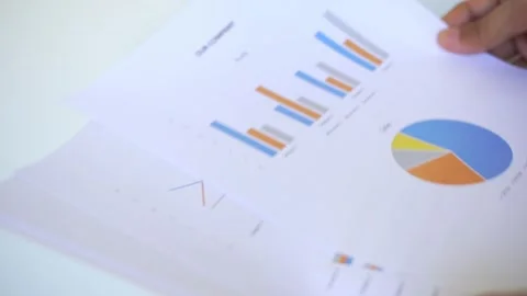 Analyzing Financial Data and Business Performance Reports Stock Footage 322109764