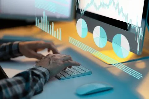 Analyzing Financial Data on Computer Screen with Interactive Graphs and Charts Foto stock