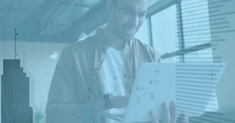 Analyzing financial data image over man using tablet in office 스톡 사진