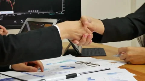 Analyzing Financial Data At Office Freelance presentation project paper chart to 스톡 동영상 334654218
