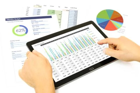 Analyzing financial data on the tablet Stock Photos