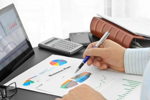 Analyzing  financial documents  in the office Stock Photos