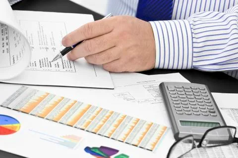 Analyzing  financial documents  in the office Stock Photos