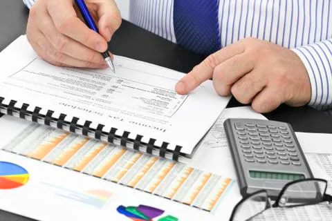 Analyzing  financial documents  in the office Stock Photos
