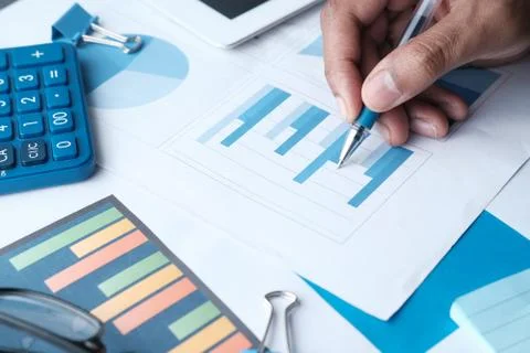 Analyzing financial graph on table, using self created chart Stock Photos