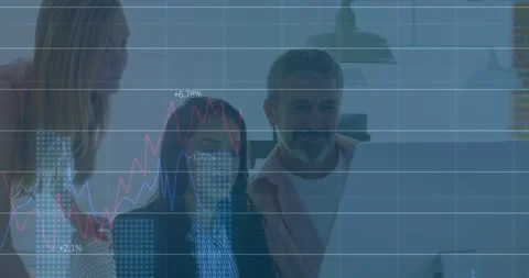 Analyzing financial graphs, business professionals using computer in office with Stock Footage 306240507