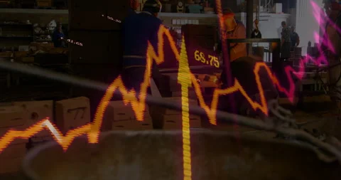 Analyzing fluctuating stock market graph, workers in factory focusing on Stock Footage 304842449
