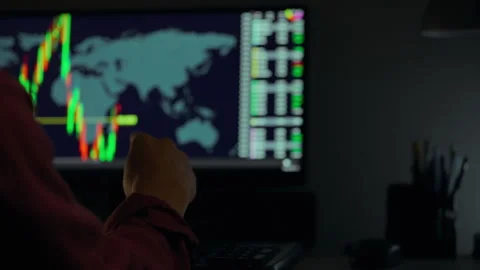 Analyzing global market trends at night with a focus on stock movement and d Stock Footage 289577601