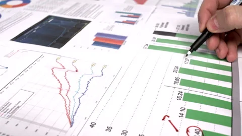 Analyzing graph of sales  Stock Footage 210196910
