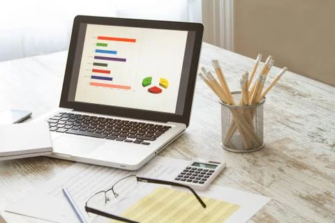 Analyzing graphics. Stock Photos