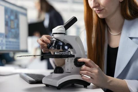 Analyzing hardware components, microscope close up and scientist Stock Photos