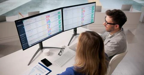 Analyzing Healthcare Data On Computers In A Training Workshop Stock Photos