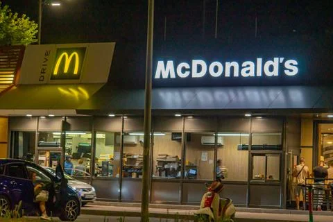 Analyzing an image of a nighttime urban setting, possibly in the context of.. Photos