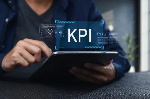 Analyzing Key Performance Indicators on a Tablet Device Stock Photos