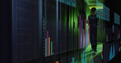 Analyzing Korean IT engineer reviewing data on tablet in server corridor, with Stock Photos