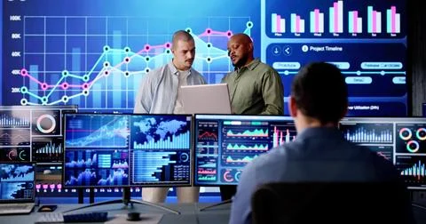 Analyzing KPI dashboard data on computer to monitor server control Stock Photos