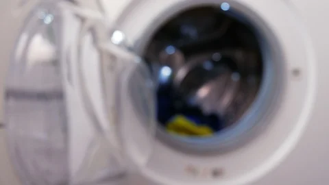 Analyzing the label with cleaning instructions before putting the clothes into a Video stock 88394534