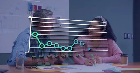 Analyzing line chart overlay with team reviewing color swatches and mockups at Stock Photos