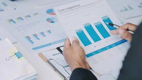 Analyzing loan options to make informed financial decisions for business 動画素材 325474722
