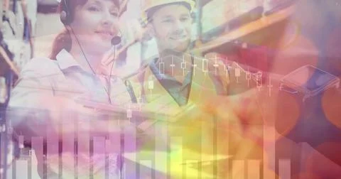 Analyzing logistics data, warehouse workers using technology and headsets in Foto stock