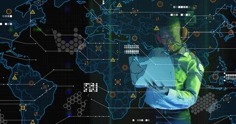 Analyzing man in shirt exploring digital world map overlay at control room, with 库存照片