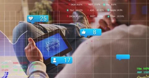 Analyzing man using tablet while viewing blueprint and social icons in home Stock Photos