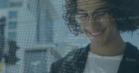 Analyzing man wearing dark blazer behind translucent network scan panel at Stock Photos