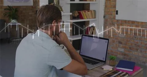 Analyzing man wearing light short-sleeve shirt viewing blank laptop screen at Stock Photos