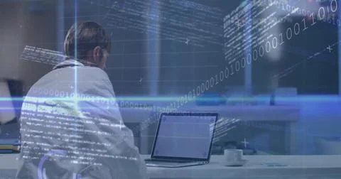 Analyzing man in white lab coat scanning laptop screen at desk with holograms, 写真素材