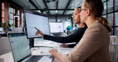Analyzing Market Data On Corporate Software, Female Analyst Looking For Strat Stock Photos