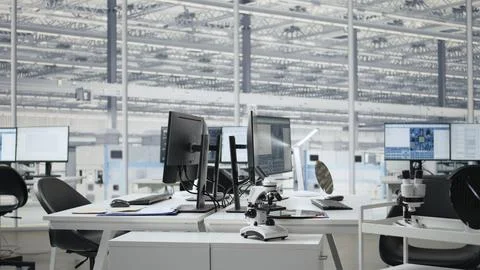 Analyzing microchip architecture systems, computers and empty engineering office Stock Photos