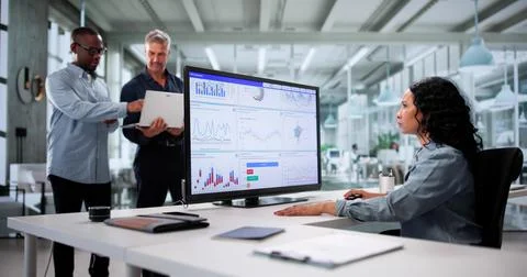 Analyzing Multicultural Data: A Diverse Team Predicts Business Performance Stock Photos
