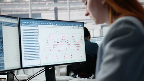 Analyzing PCB architecture, PC software close up and woman in factory office Stock Footage 335882414