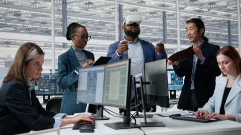 Analyzing PCB architecture, VR headset and multiethnic engineering team Stock Footage 335882118