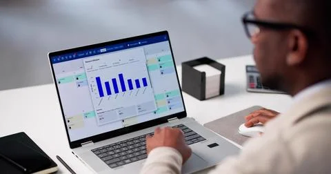 Analyzing Productivity Data On Laptop In Online Calendar Software App. Stock Photos