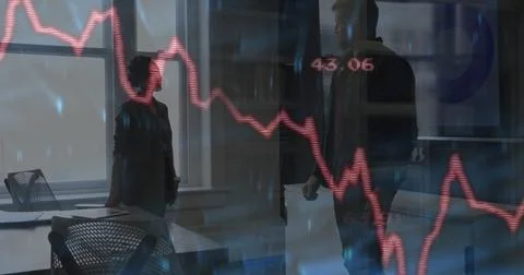 Analyzing red line graph colleagues in business attire presenting data in Stock Photos