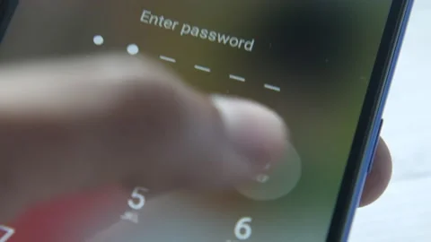 Analyzing stock chart on smart phone at night Stock Footage 166740223