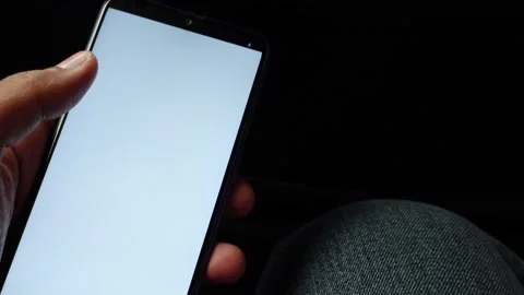 Analyzing stock chart on smart phone at night Stock Footage 166740299