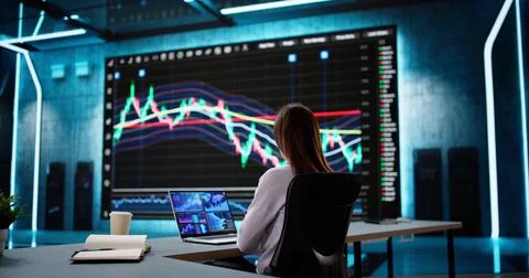 Analyzing Stock Data on Computer Screen: Businesswoman Stock Photos
