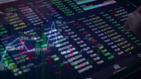 Analyzing Stock Market Data on Digital Tablet Stock Footage 336478484