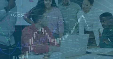 Analyzing team of 7 leaning around laptop in meeting, wearing business casual Stock Photos