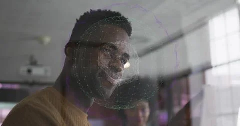 Analyzing tech professional interacting with holographic sphere behind glass  Stock Photos