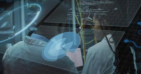 Analyzing virtual interface, two technicians in lab coats adjusting network Stock Photos