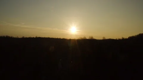 Anamorphic aerial view of sunset over the hills Stock Footage 122996745