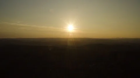 Anamorphic aerial view of sunset over the hills Stock Footage 122996751