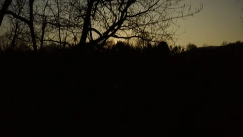 Anamorphic aerial view of sunset over the hills Stock Footage 122996983