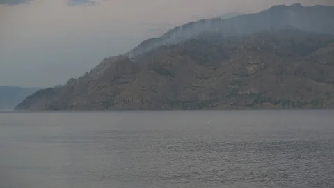 Anamorphic Forest Fire on Mountain Next to Lake Stock Footage 93063841