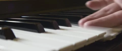 Anamorphic glissando playing on keyboard 5.7K video Stock Footage 303959872