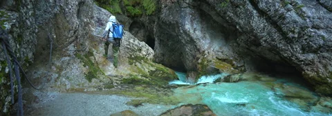 Anamorphic Lens 6K - Boy exploring a Dolomite canyon Stock Footage 341642491
