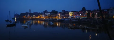 Anamorphic Lens 6K - First lights of dawn on Lake Maggiore in Italy Stock Footage 330347498